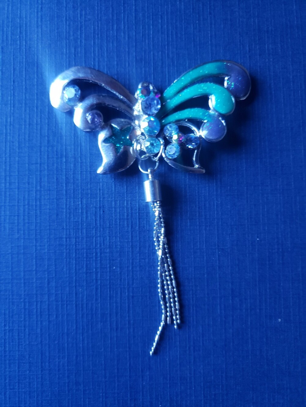 Silver Butterfly Tassel Pendant with Teal Accents